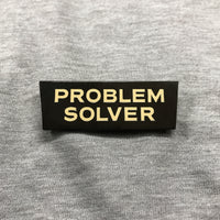Problem Solver Pin (Nickel with white letters)