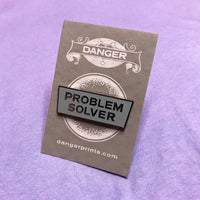 Problem Solver Pin (Gray with nickel letters)